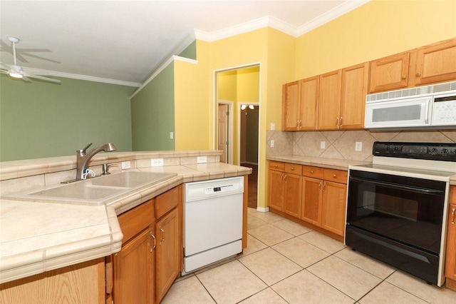 kitchen with white appliances, tile countertops, ornamental molding, and light tile patterned floors