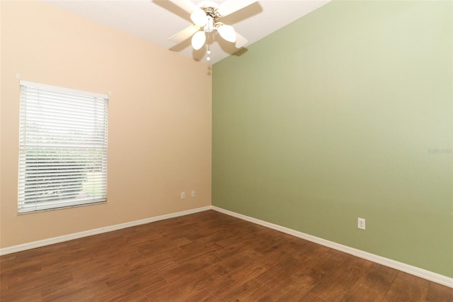 unfurnished room with dark hardwood / wood-style flooring and ceiling fan