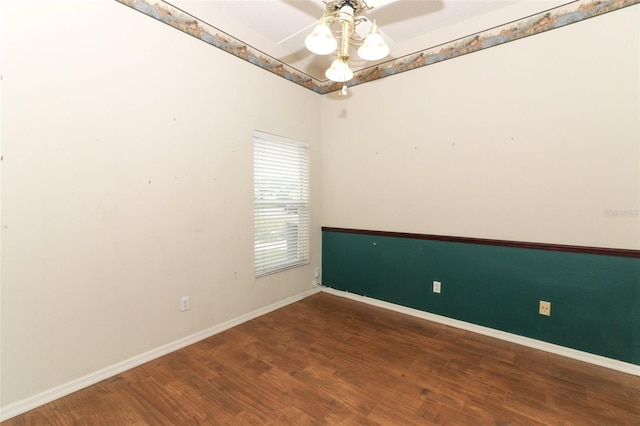 spare room with wood-type flooring and ceiling fan