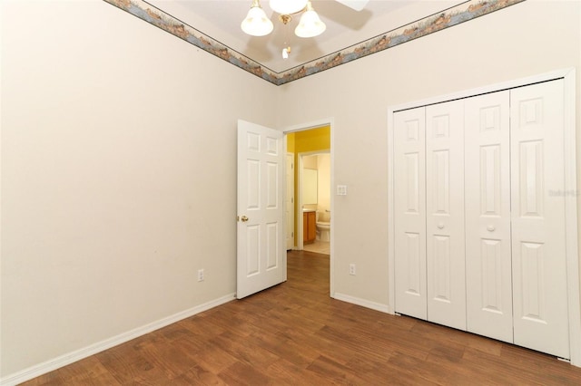 unfurnished bedroom featuring wood-type flooring, a closet, and ceiling fan