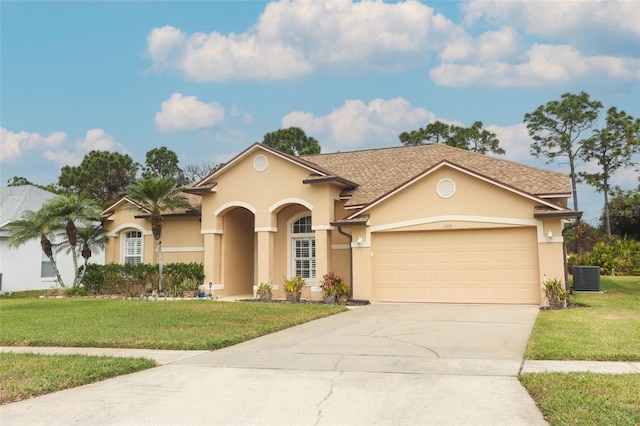 view of front of property featuring a garage, central air condition unit, and a front lawn