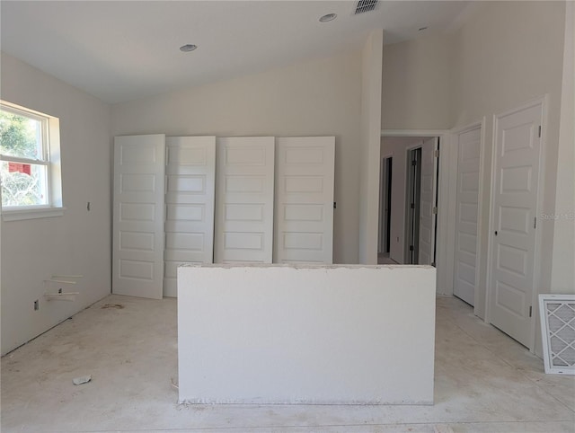 kitchen featuring a kitchen island and vaulted ceiling