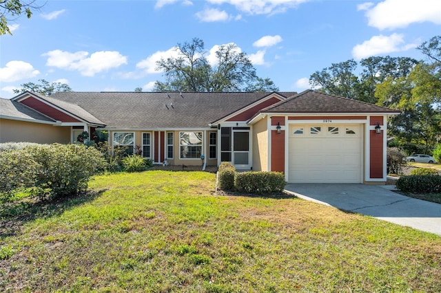 ranch-style home with a front lawn and a garage