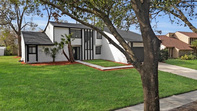 view of front of home with a front lawn