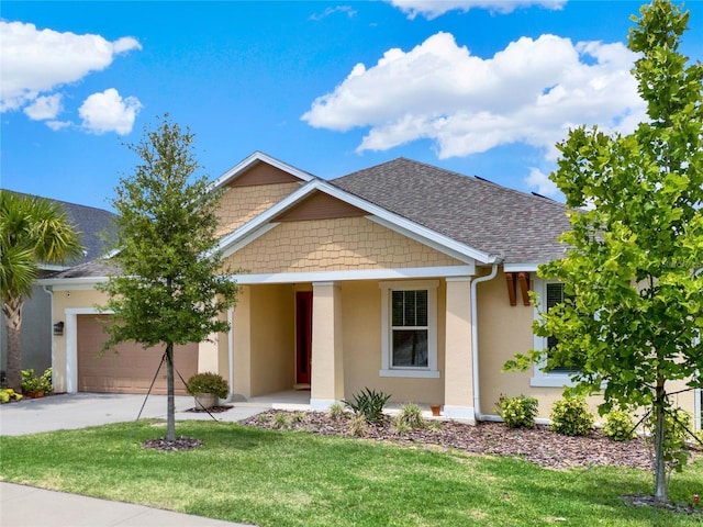 view of front of property with a front yard and a garage