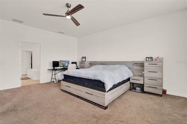 carpeted bedroom featuring ensuite bathroom and ceiling fan