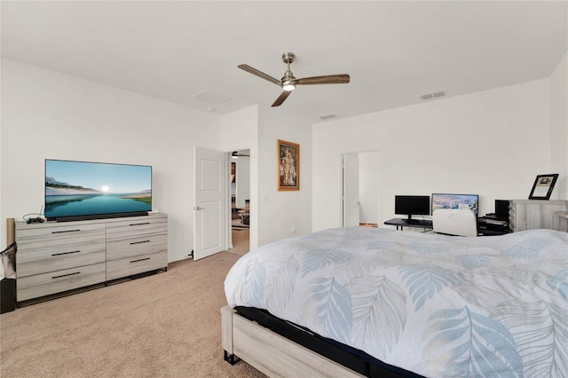 bedroom with ceiling fan and light carpet