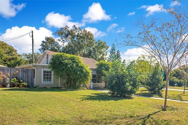 obstructed view of property with a front yard