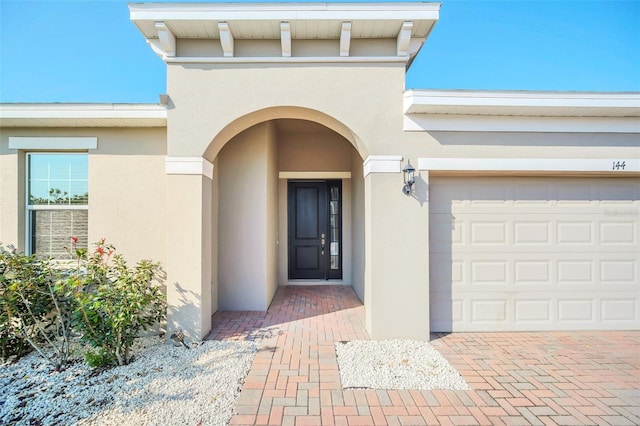 property entrance with a garage