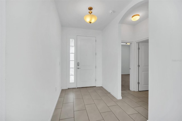 foyer entrance featuring light tile patterned floors