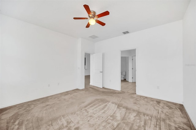 unfurnished bedroom featuring light colored carpet and ceiling fan