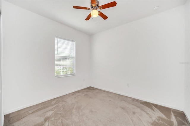 unfurnished room featuring carpet floors and ceiling fan