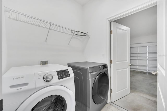 laundry area with washing machine and dryer