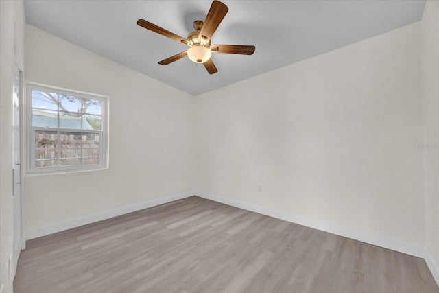 empty room featuring ceiling fan and light hardwood / wood-style flooring