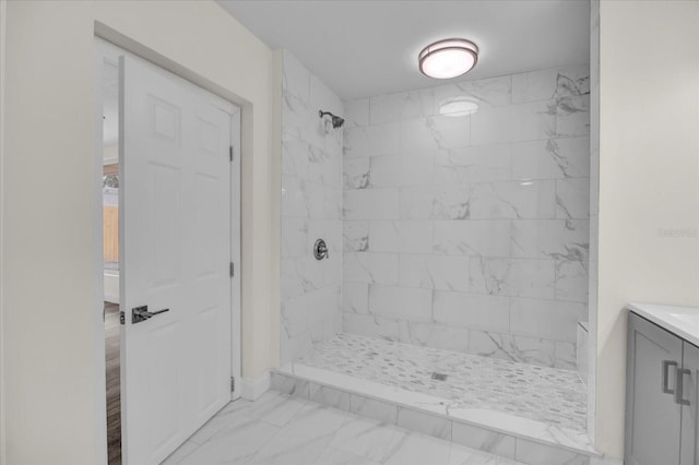 bathroom featuring vanity and a tile shower