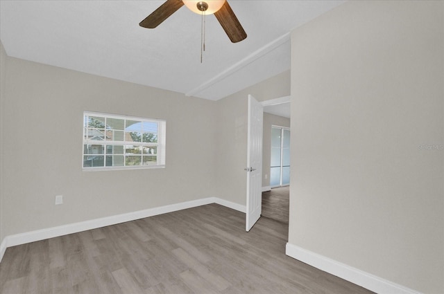 unfurnished room featuring ceiling fan and light wood-type flooring