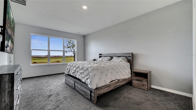 bedroom with dark carpet