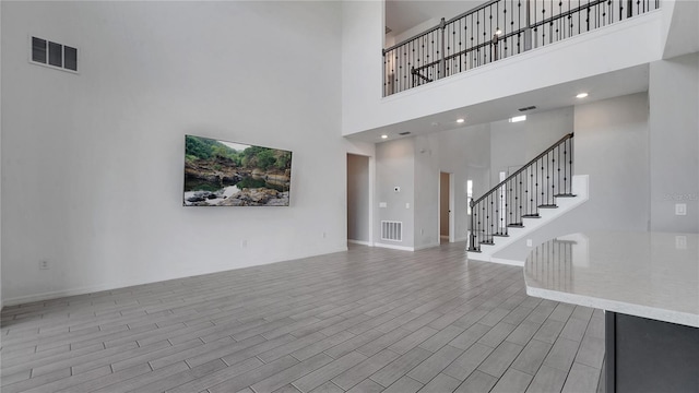 entryway with a towering ceiling