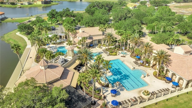 birds eye view of property with a water view