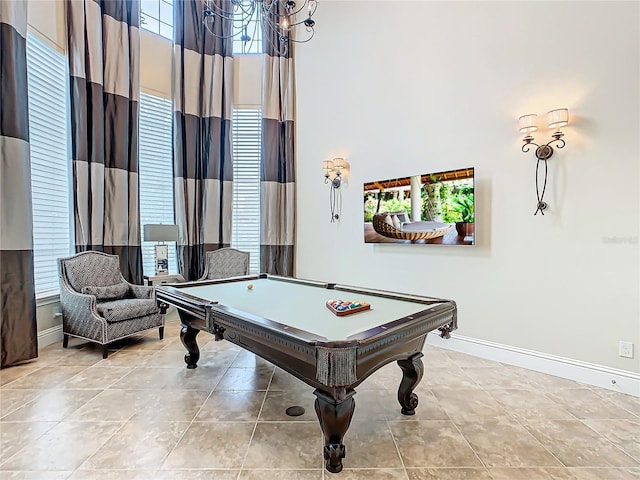 game room featuring a high ceiling, billiards, and a healthy amount of sunlight