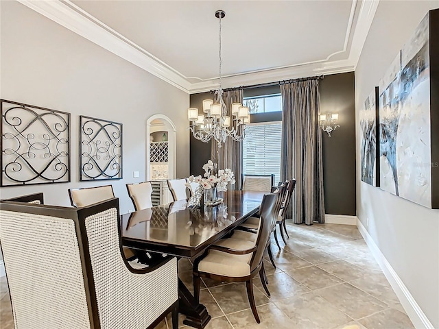 tiled dining space featuring a notable chandelier and crown molding