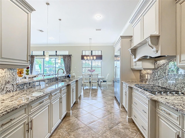 kitchen with stainless steel appliances, sink, backsplash, pendant lighting, and crown molding