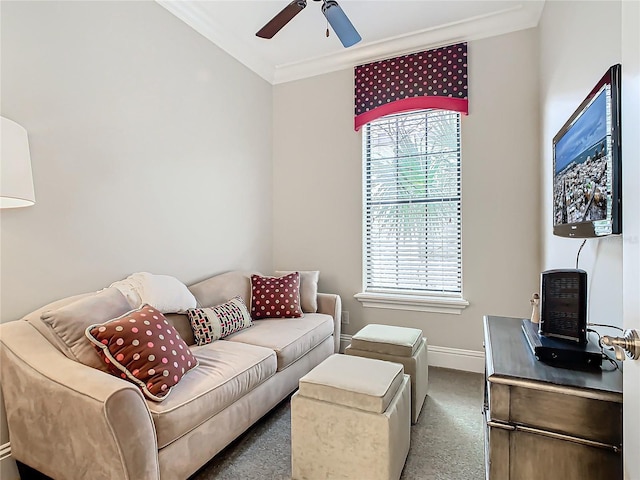 carpeted living room featuring a healthy amount of sunlight, ceiling fan, and ornamental molding