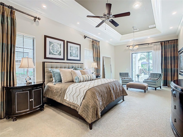 bedroom with crown molding, light carpet, ceiling fan with notable chandelier, and a tray ceiling