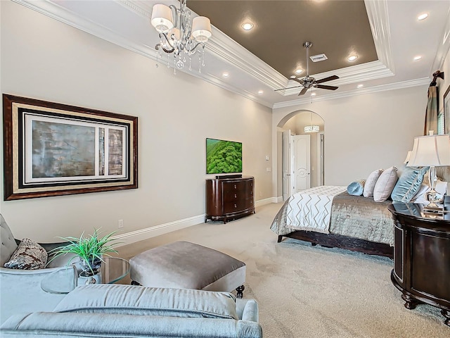 bedroom with crown molding, light carpet, ceiling fan with notable chandelier, and a tray ceiling