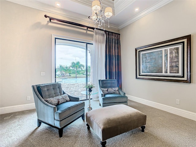 living area featuring an inviting chandelier, crown molding, and carpet flooring