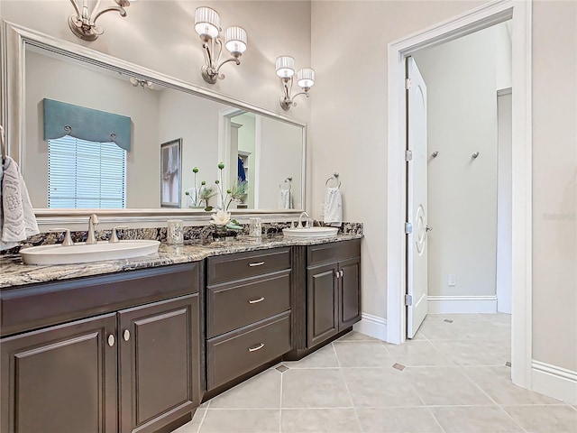 bathroom with tile patterned floors and vanity