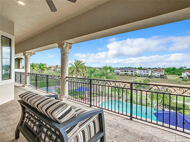 balcony with a patio area and ceiling fan