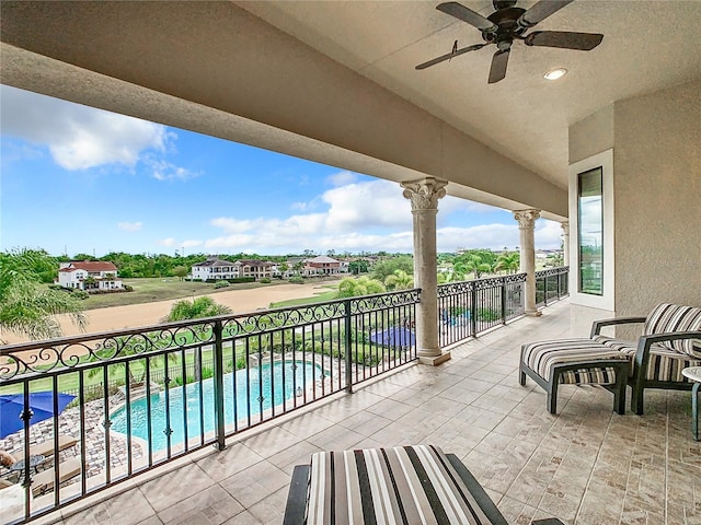 balcony with a patio and ceiling fan