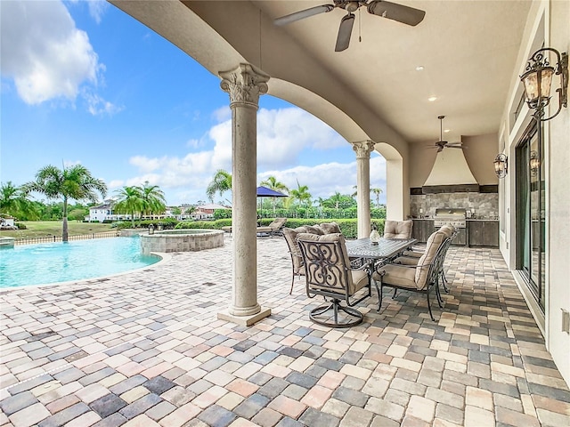 view of patio / terrace with an outdoor kitchen, grilling area, and ceiling fan