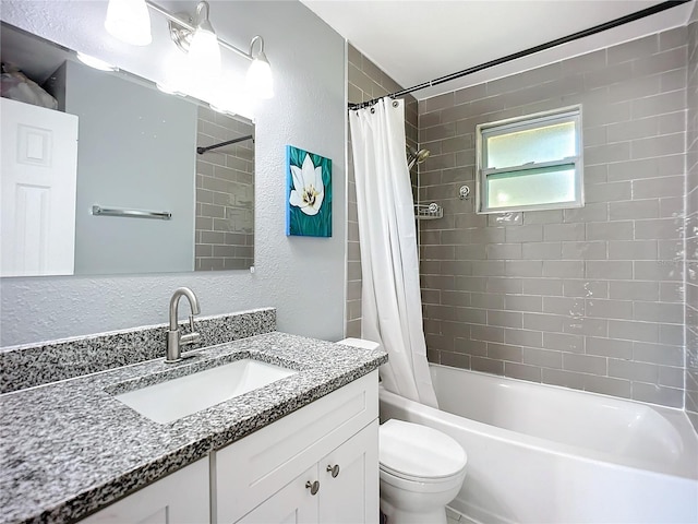 full bathroom featuring shower / bath combo with shower curtain, vanity, and toilet