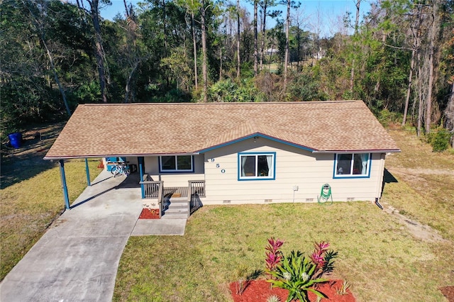 ranch-style house featuring a carport and a front lawn