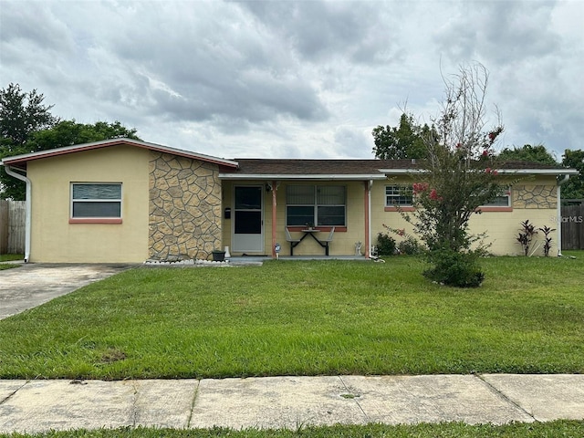 single story home featuring a porch and a front yard