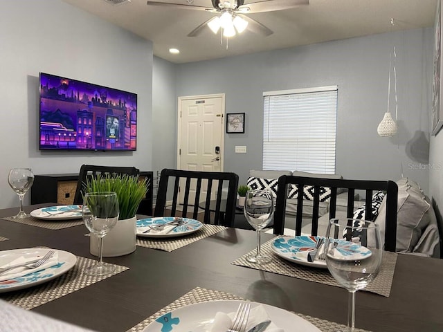 dining space with ceiling fan