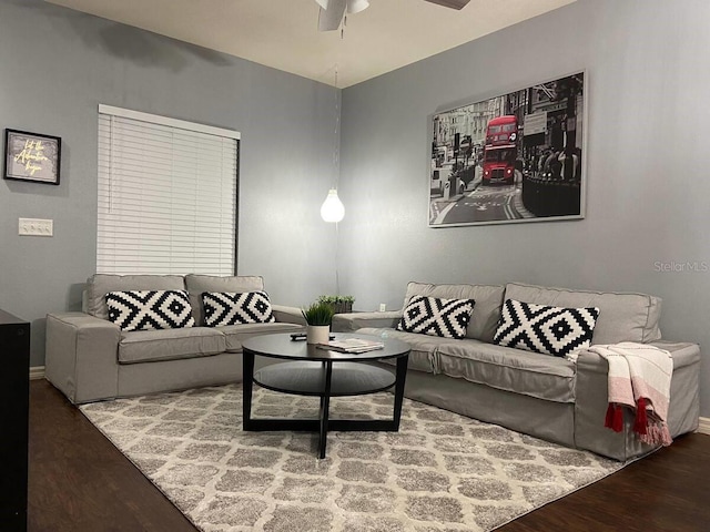 living room featuring ceiling fan and hardwood / wood-style floors