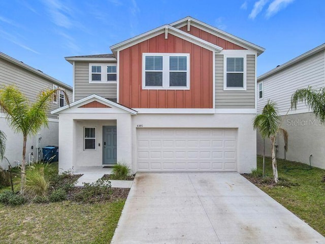 view of front of property featuring a garage and a front lawn