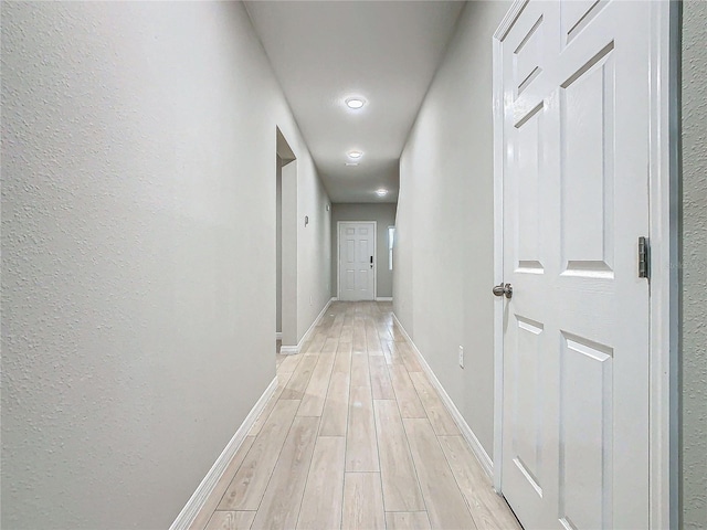 corridor featuring light wood-type flooring