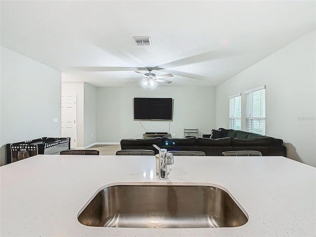 kitchen featuring sink and ceiling fan