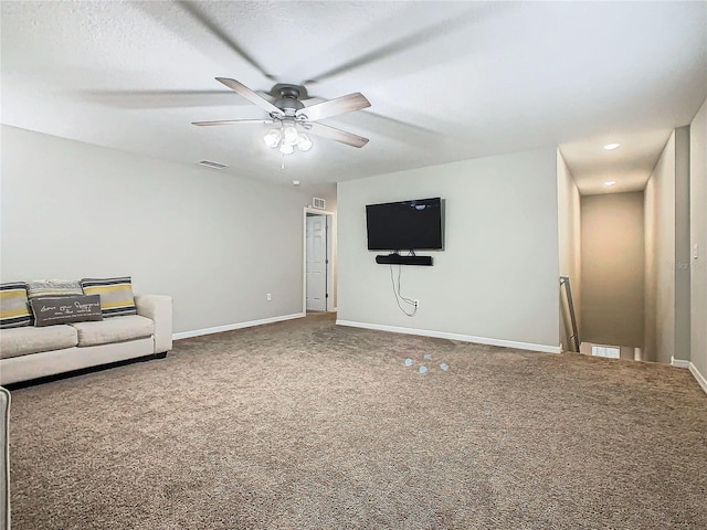 unfurnished living room with ceiling fan and carpet flooring