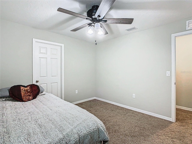 bedroom with dark carpet and ceiling fan