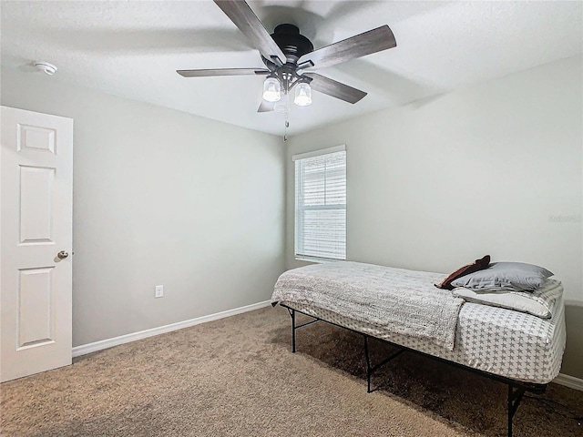 bedroom with ceiling fan and carpet