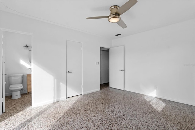 unfurnished bedroom with a closet, ceiling fan, and ensuite bathroom