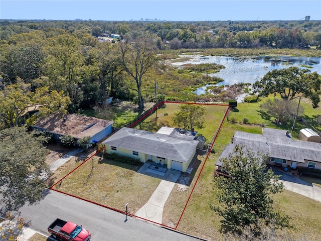 birds eye view of property with a water view