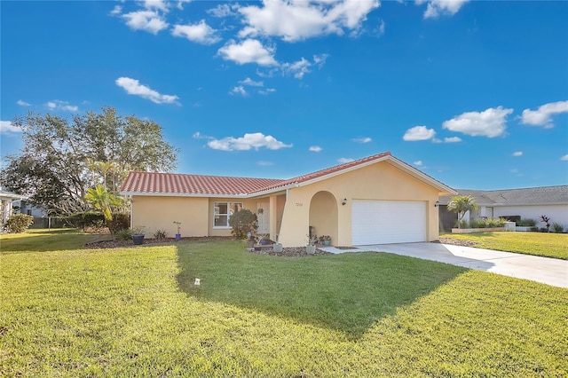 view of front of home featuring a front yard and a garage