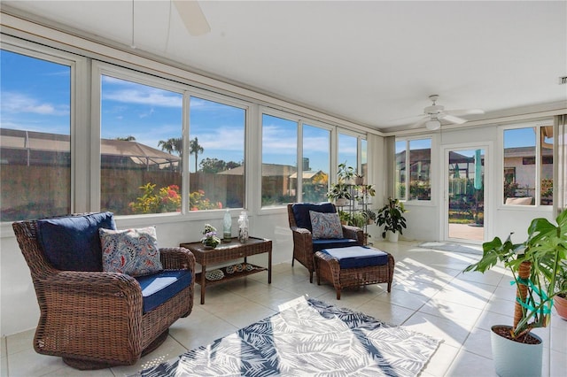 sunroom with ceiling fan and a wealth of natural light