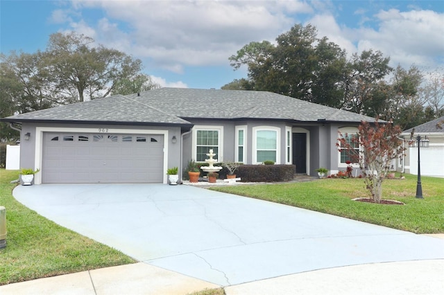 single story home featuring a garage and a front yard